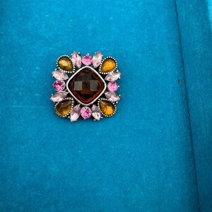 Gorgeous brooch with bronze and pink tones. Vintage look with glow elements.